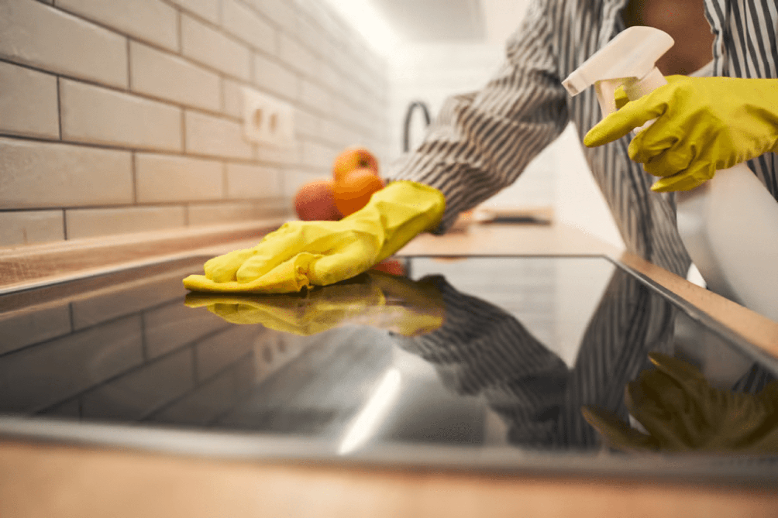 Close-up of a kitchen cooktop being deep cleaned